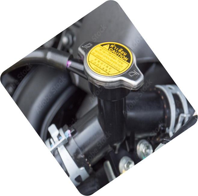 Close-up of an engine part with an automotive label