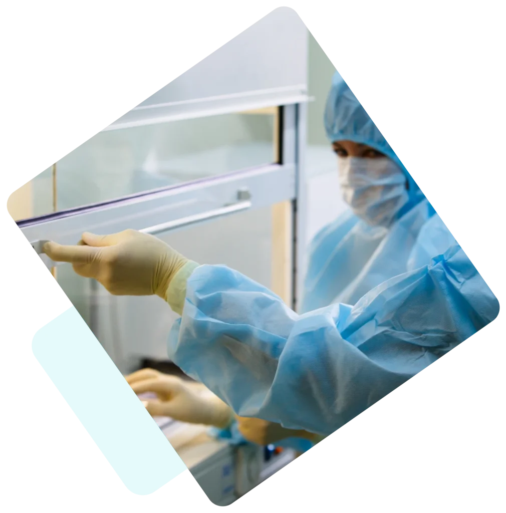 Image of a person opening in a hood in an environment where sterile labels could be used